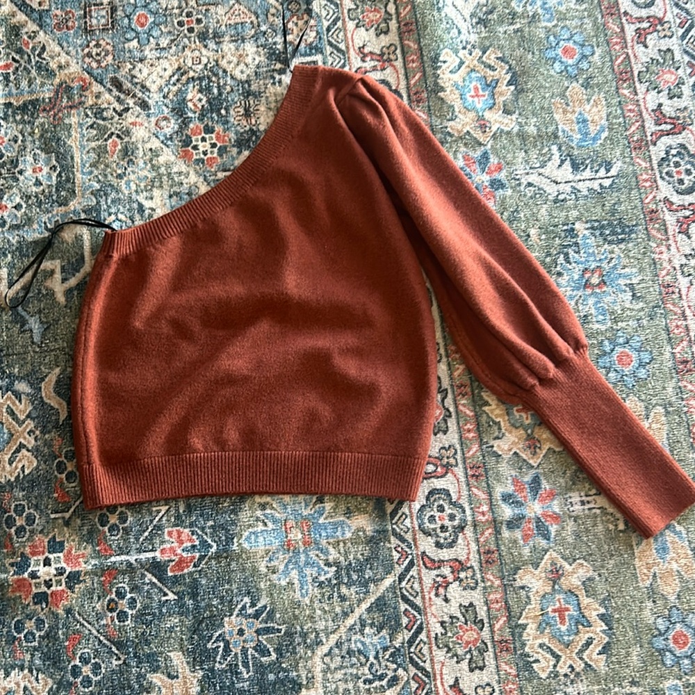 Never worn single sleeve sweater